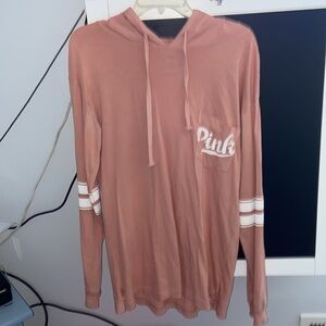 NWOT.. PINK long sleeve hooded tee .New condition. Size Small.Fits Like A Medium